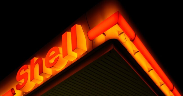 Truck refueling at station with fuel cost management and analytics