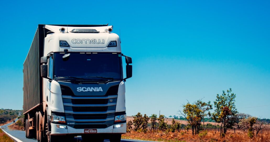 Truck driving on highway reducing empty miles with load matching